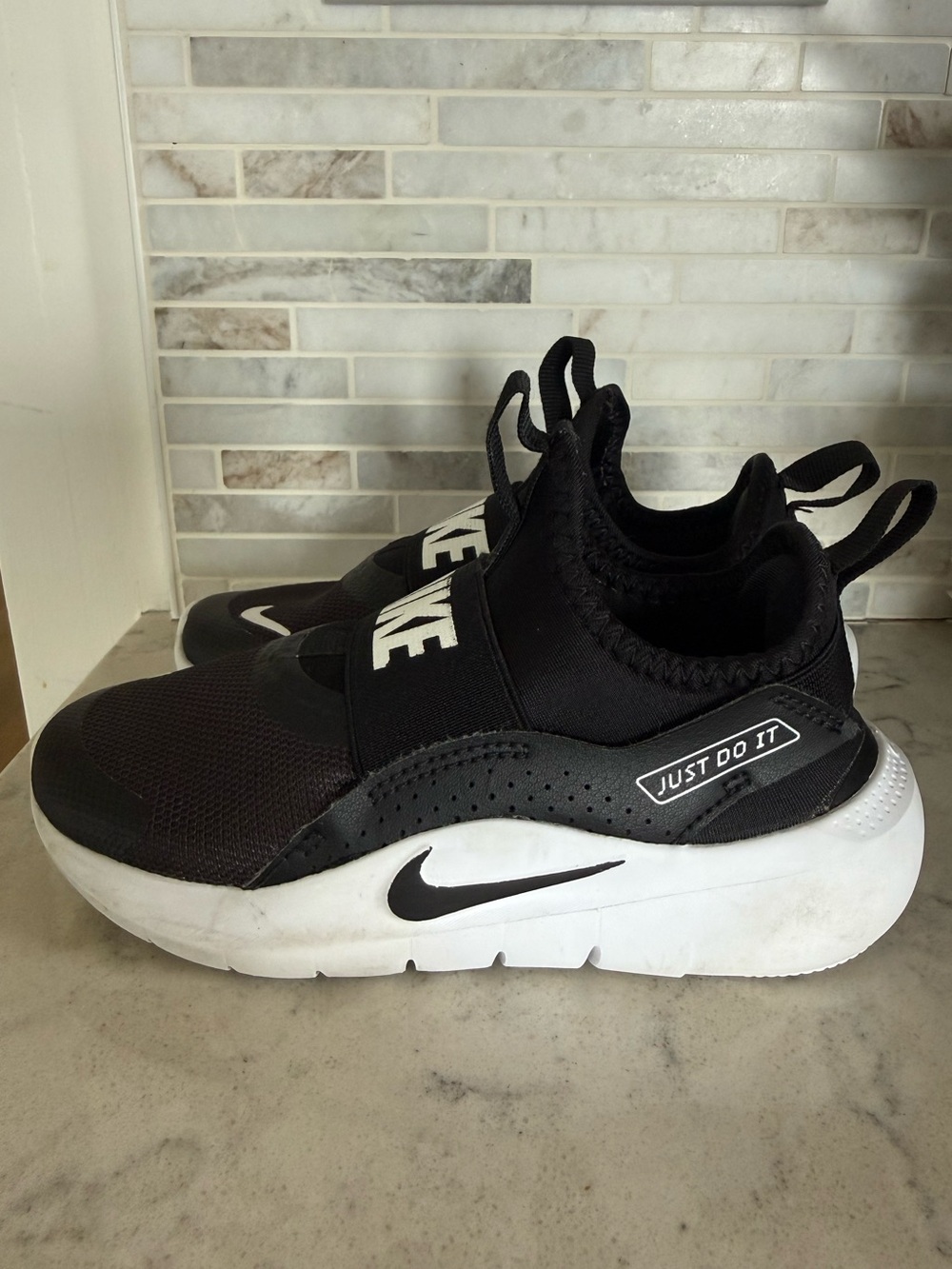 Nike Kids Black and White Slip-On Sneakers with 'Just Do It' Strap